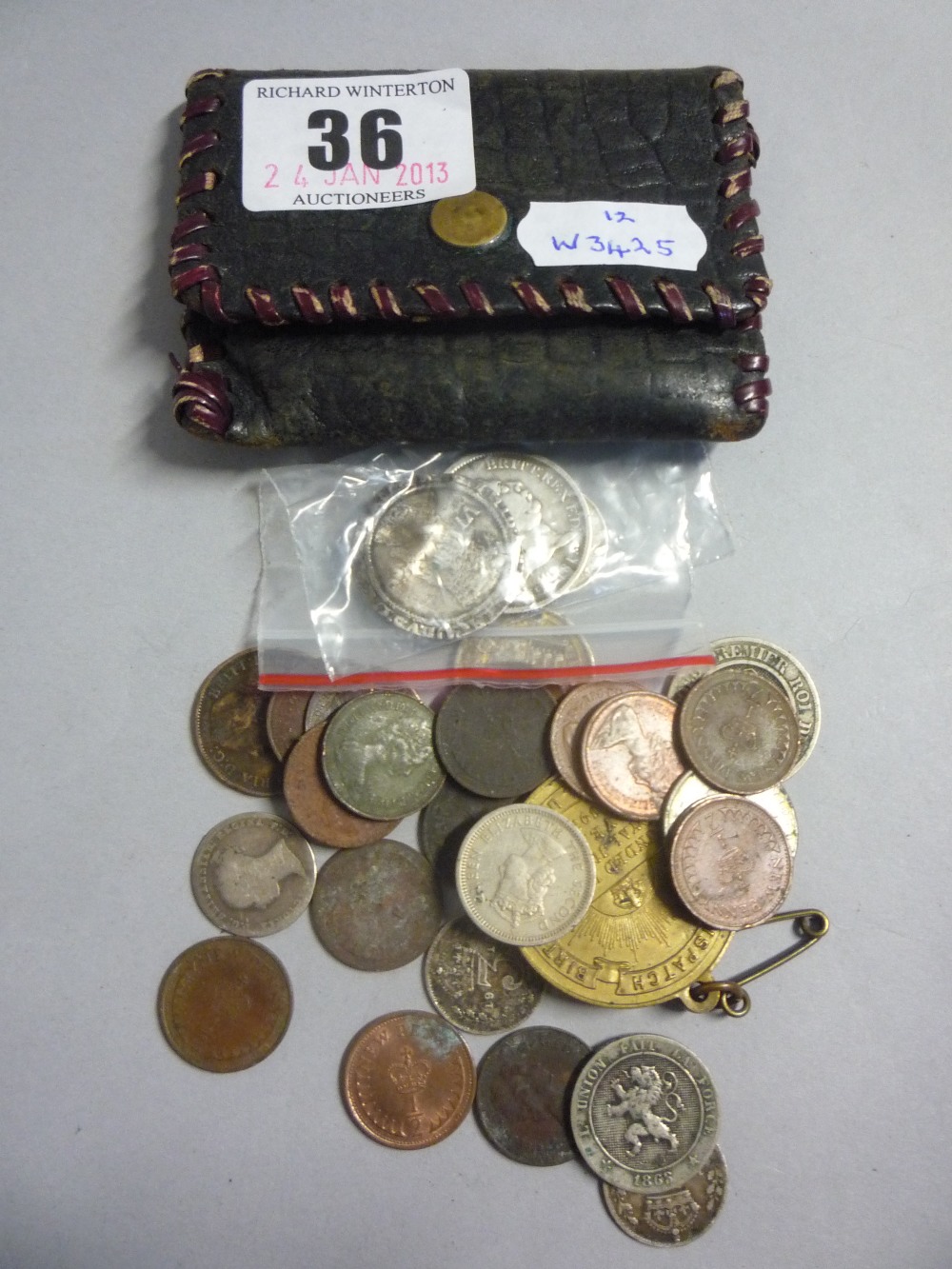 A purse with various coins including James I sixpence