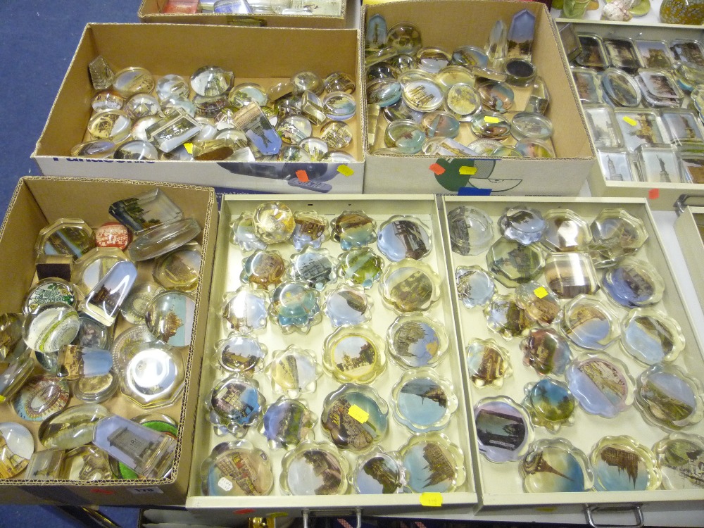 Five trays of novelty picturesque glass paperweights