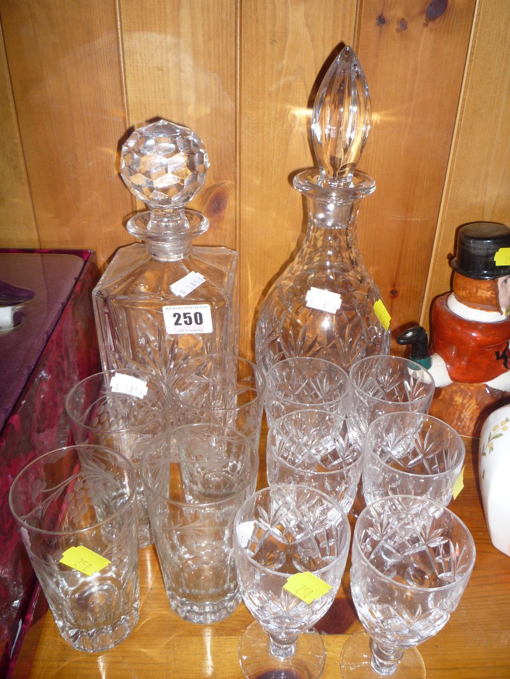 A cut glass decanter and six glasses, another cut glass decanter and four etched glasses (12)