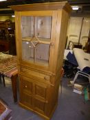 A pine glazed kitchen cabinet with a single drawer and cupboard below