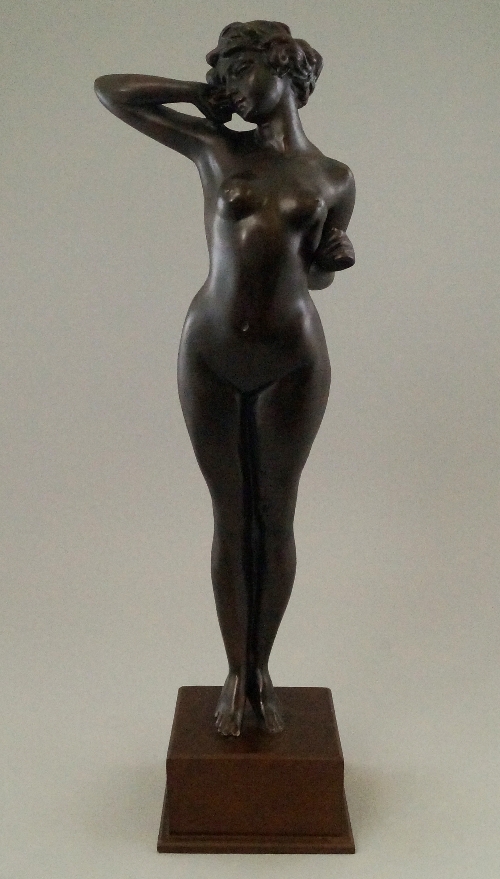 An Art Deco style bronze female nude sculpture, standing full length, modelled in the round with