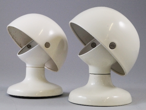 A pair of white plastic table lamps by Flos, c.1960`s, with adjustable white domed shades