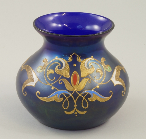 A Lobmeyr style iridescent blue glass gilt and enamelled vase, late 19th/ early 20th century, of