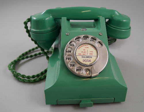 A GPO green bakelite rotary dial telephone, c.1950s, having rotary dial to the front with central