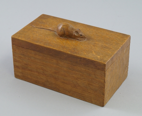 Robert `Mouseman` Thompson, a carved oak cigarette box, 20th century, of rectangular form, the cover