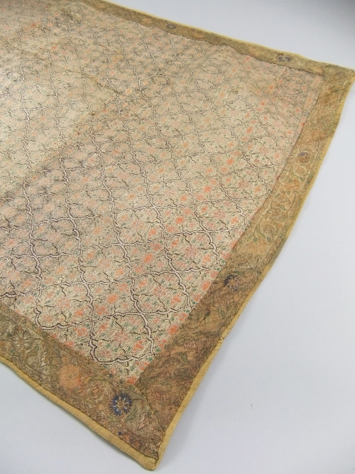 A Persian style machine woven silk panel, the interior decorated with continuous stylised four petal