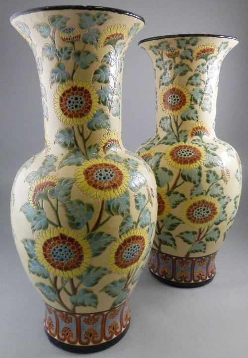 A large pair of Burmantofts style baluster vases, 20th century, overall decorated with sunflowers