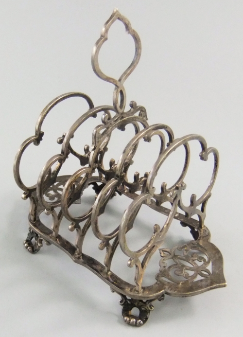 A 19th century silver Gothic Revival four division toast rack by Edward Barnard and John Barnard,