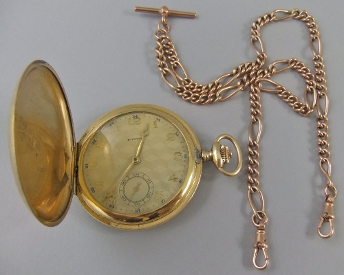 AMENDMENT- The watch is gold plated not 14K- A 14k gold cased full hunter by Favor, with gilt engine