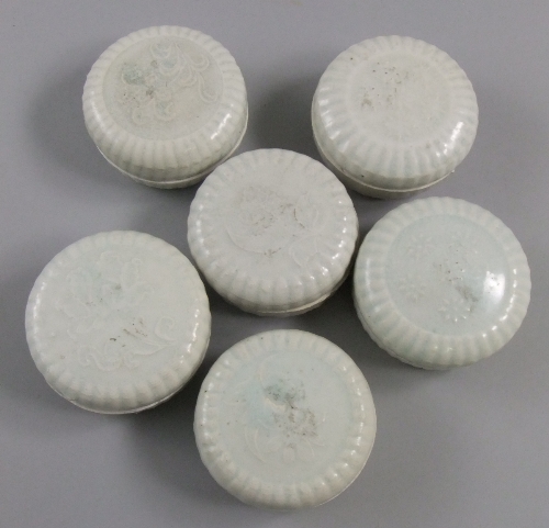 Six Chinese yingqing pale celadon glaze cosmetic boxes with covers, of circular form with ribbed