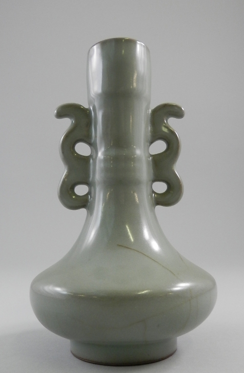 A Chinese Guan type celadon twin handled bottle vase, Qing Dynasty, slender moulded neck with twin