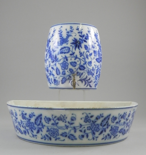 A German blue and white cistern and tray, 19th century, decorated with Deutsche blumen style