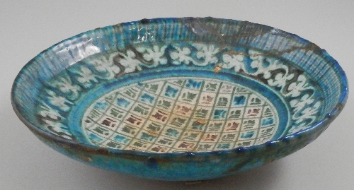 A Persian green and blue glazed pottery charger, circa 17th century, of circular form and