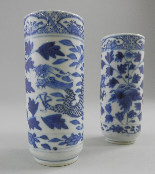 A pair of Chinese blue and white dragon posy vases, decorated with blue stylised flowering foliage