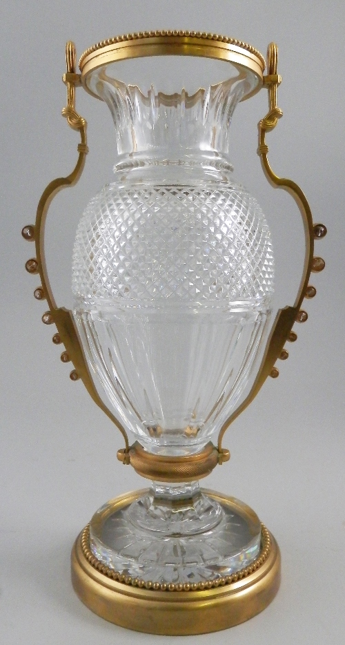 A large Baccarat cut glass and gilt metal mounted twin handled vase, 20th century, of baluster form,