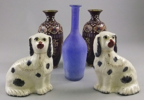 A pair of Staffordshire style pottery spaniels, seated, 19cm high, with a pair of Chinese