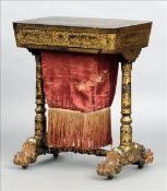 A 19th century chinoiserie lacquered work table The hinged rectangular top enclosing various
