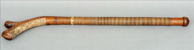 A 19th century Fijian gun stock club Of typical carved form, the handle with a banded string