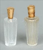 Two 19th century Continental gold mounted cut glass scent bottles Each of tapering cylindrical