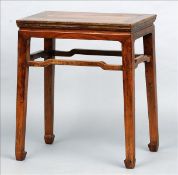 A late 19th century Chinese elm side table The cleated rectangular top above tapering square section