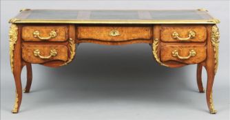 A large late 19th century ormolu mounted burr walnut and kingwood bureau plat, in the style of Linke
