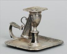 A George III silver chamberstick, hallmarked London 1807, maker`s mark of WJ Of shaped rectangular