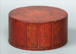 An 18th century Chinese gilt decorated red lacquer cylindrical box The fourteen side panels