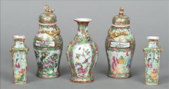 A pair of late 19th century Cantonese famille rose vases and covers Each with gilt dragon