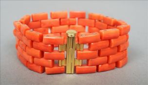 An unmarked yellow metal mounted coral bracelet Of rectangular link form; together with five spare