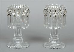 A pair of 19th century clear cut glass table lustres Each shaped drip-pan hung with faceted glass