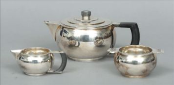 A George V Art Deco silver three piece tea set, each piece hallmarked Birmingham 1932, maker`s