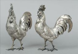 A pair of Continental silver model cockerels Each naturalistically formed with glass inset eyes