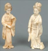 An early 20th century ivory okimono Carved as a robed woman with a bag at her feet; together with