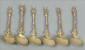 A set of six Continental silver gilt Apostle spoons Each with a figural mounted finial, the