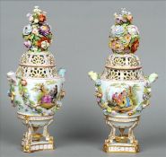 A pair of 19th century Continental porcelain pot pourri vases and covers Each pierced removable