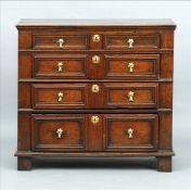 An 18th century oak chest of drawers The moulded rectangular top above four geometrically moulded