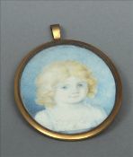 ENGLISH SCHOOL (20th century) Portrait Miniature of a Child Watercolour on ivory 7 cms wide overall,