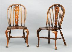 A pair of 18th century style beech and elm Windsor chairs Each hooped back supported by spindles and