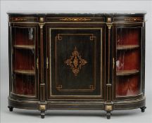 A Victorian inlaid and ormolu mounted ebonised credenza The moulded shaped top above an inlaid