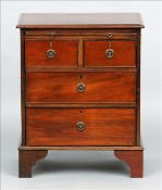 A mahogany chest of drawers of small proportions The moulded rectangular top above a brushing