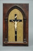 A 19th century carved ivory Corpus Christi Typically modelled attached to a carved wooden cross
