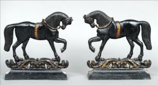 A pair of 19th century casts iron flat back door stops Each formed as a horse and standing on a