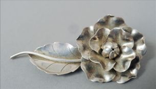 A Georg Jensen Inc. Sterling silver brooch Formed as a blooming flower. 8.5 cms high. Overall