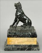 A Continental carved marble dog Modelled naturalistically seated, standing on a stepped plinth base.