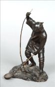 A late 19th century Japanese bronze figure Formed as a fisherman netting his catch, the reverse with