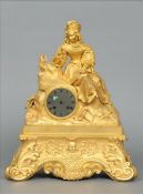 A 19th century ormolu mantle clock Surmounted with a young lady gazing at a miniature portrait above