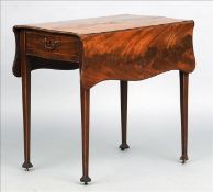 A George III mahogany Pembroke table The twin flap serpentine top above a single frieze drawer