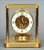 A Jaeger le Coutre Atmos clock Typically formed and housed in a glazed square section case, the base