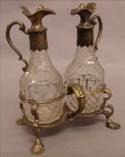 A George II silver two bottle cruet stand, probably hallmarked London 1750, maker`s mark of JW The