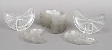 A set of twelve Lalique side dishes Each kidney shaped dish decorated with stylised leaves and